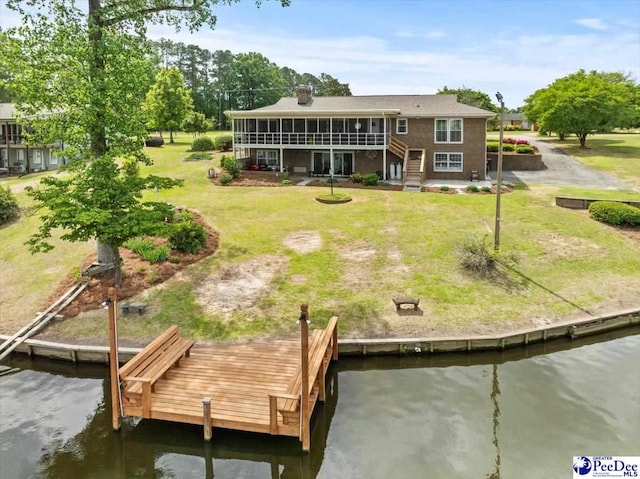 244 Timberlake Dr, Florence, SC 29501 - rear view of property featuring a sunroom, a water view, and a lawn