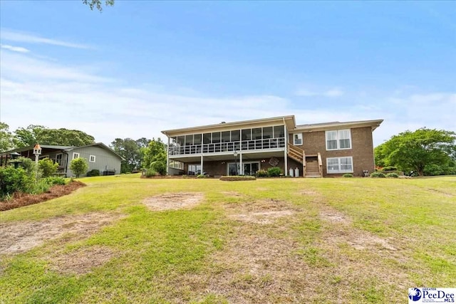 244 Timberlake Dr, Florence, SC 29501 - rear view of house with a sunroom, stairway, and a yard
