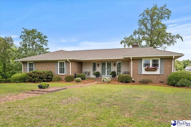 244 Timberlake Dr, Florence, SC 29501 - single story home with brick siding, a chimney, a front yard, and a porch