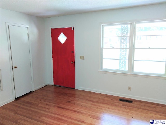 foyer with light hardwood / wood-style floors