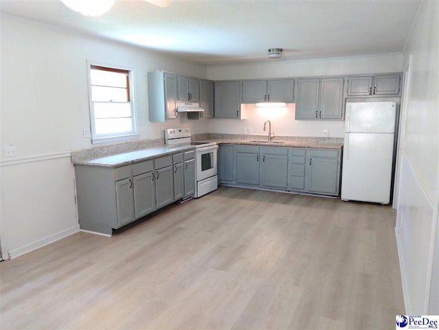 kitchen with white appliances, gray cabinets, and sink