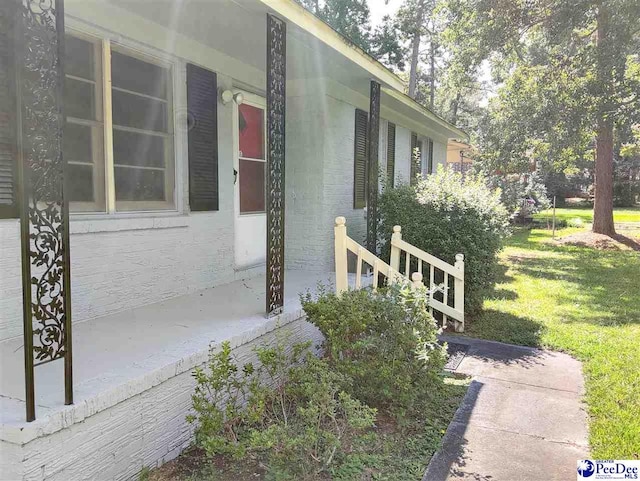 view of home's exterior with a yard