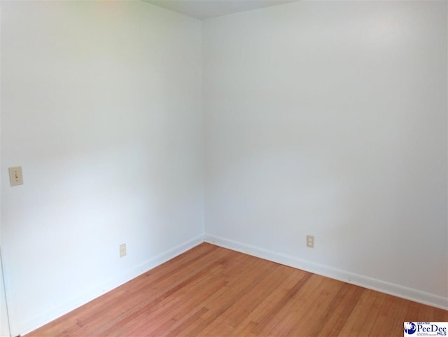 spare room featuring light hardwood / wood-style flooring