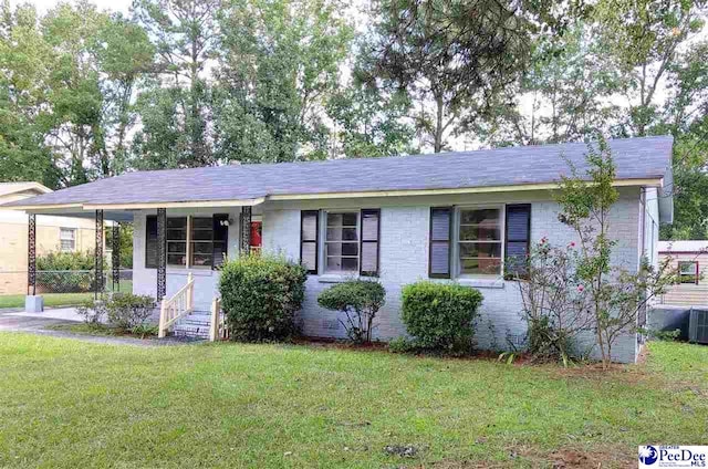 ranch-style house with a front lawn