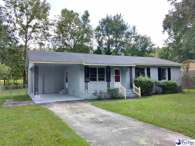 ranch-style home with a front yard and a carport