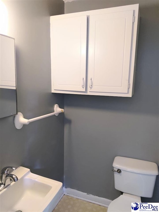 bathroom with sink and toilet