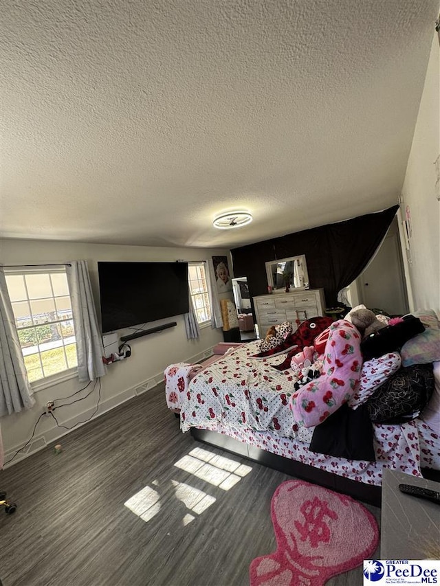 1770 Woods Dr, Florence, SC 29505 - bedroom with a textured ceiling, wood finished floors, and baseboards