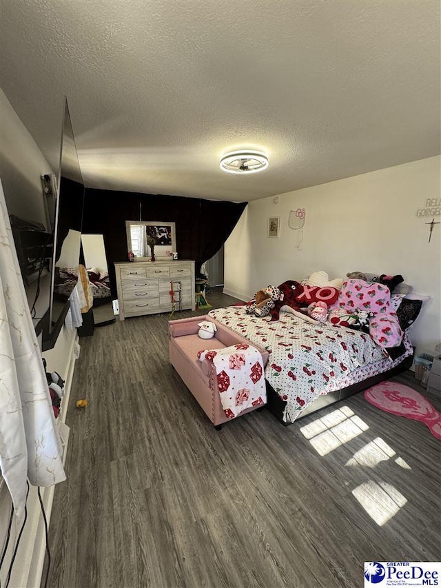 1770 Woods Dr, Florence, SC 29505 - bedroom with a textured ceiling and wood finished floors