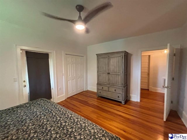 unfurnished bedroom with hardwood / wood-style flooring and ceiling fan