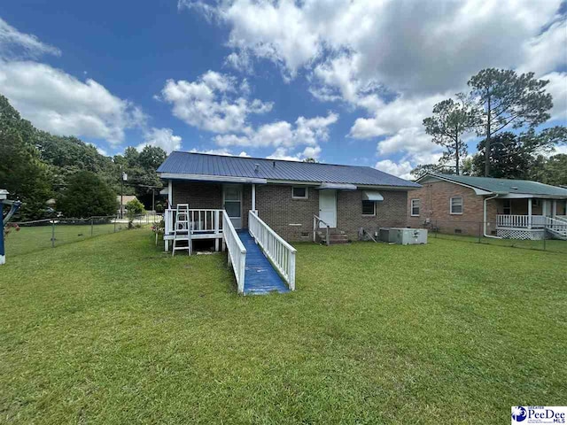719 Parrish Dr, Mullins, SC 29574 - rear view of house featuring a metal roof and brick siding