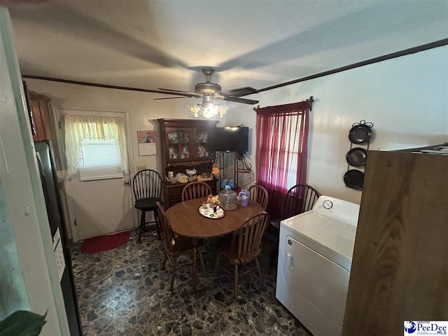 719 Parrish Dr, Mullins, SC 29574 - dining room featuring washer / clothes dryer, ceiling fan, and crown molding