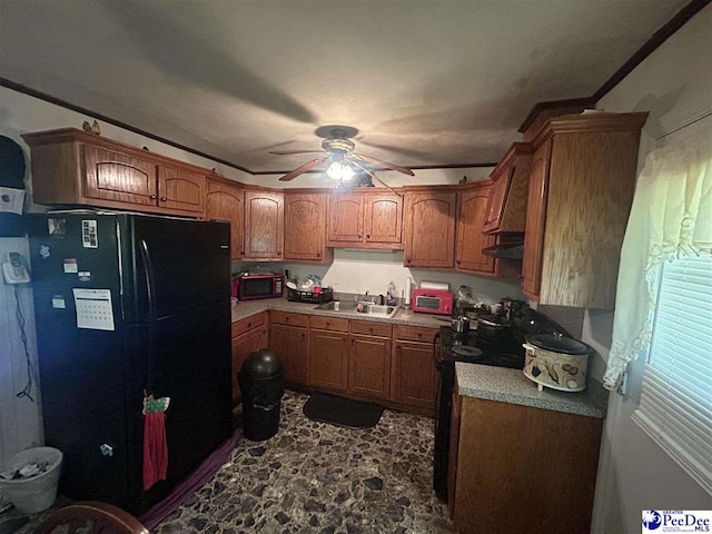719 Parrish Dr, Mullins, SC 29574 - kitchen featuring black appliances, ceiling fan, brown cabinetry, and under cabinet range hood