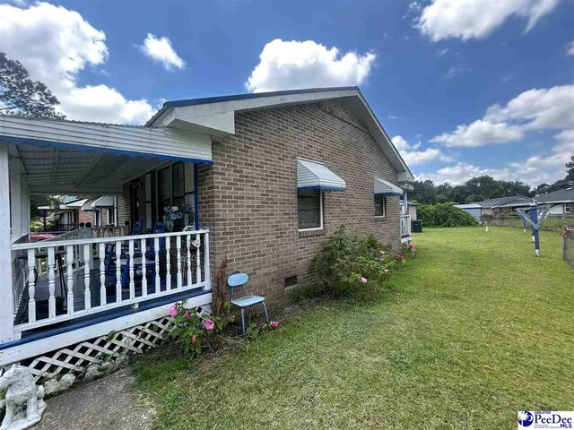 719 Parrish Dr, Mullins, SC 29574 - view of home's exterior with a yard, crawl space, and brick siding