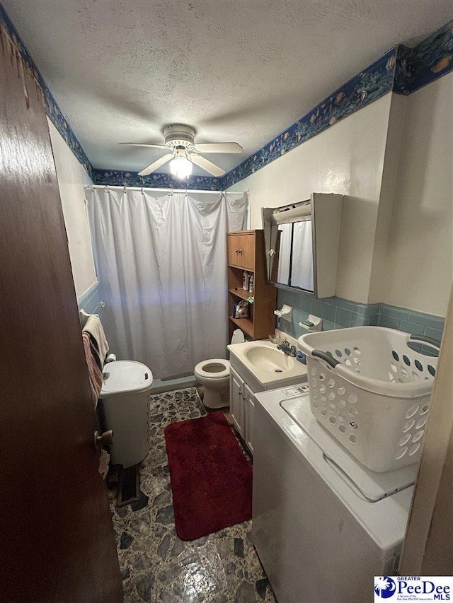 719 Parrish Dr, Mullins, SC 29574 - full bath featuring ceiling fan, a shower with curtain, vanity, a textured ceiling, and washer / dryer