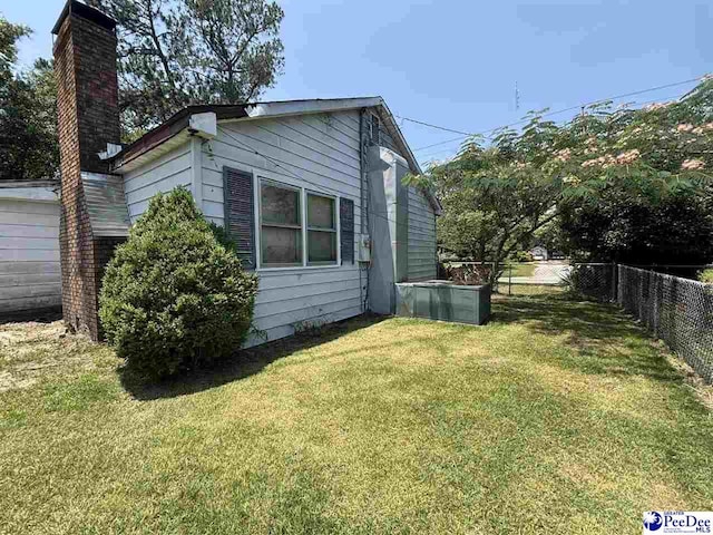 207 W Smith Ave, Darlington, SC 29532 - view of side of property with a chimney