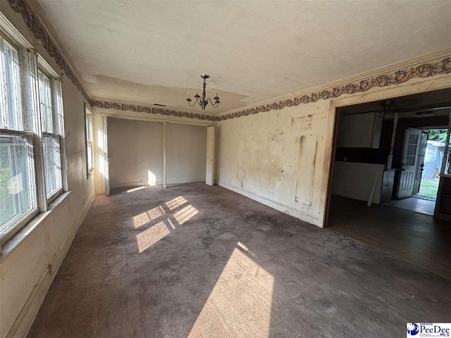 207 W Smith Ave, Darlington, SC 29532 - spare room with a chandelier, crown molding, and a textured ceiling