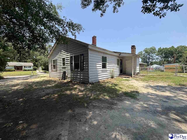 207 W Smith Ave, Darlington, SC 29532 - view of side of property with a chimney