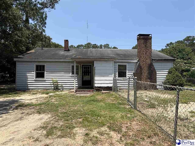 207 W Smith Ave, Darlington, SC 29532 - rear view of property featuring a chimney