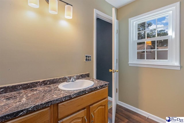 bathroom featuring vanity and wood-type flooring