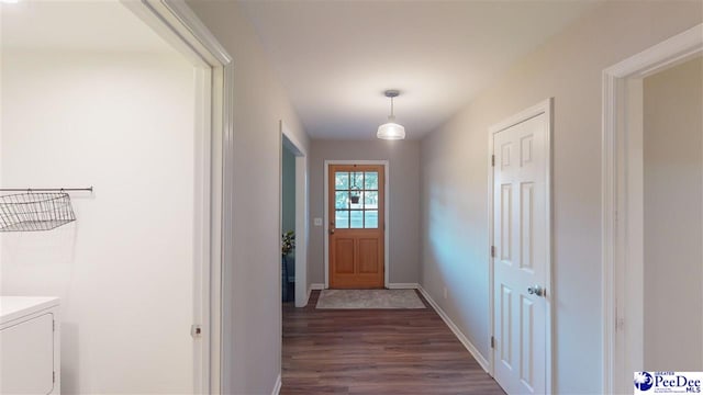 doorway to outside with dark wood-type flooring