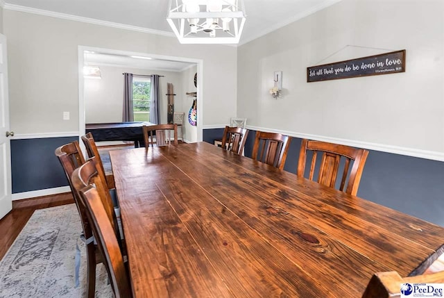 108 Wyandot St, Darlington, SC 29532 - dining area with crown molding, a chandelier, and wood finished floors