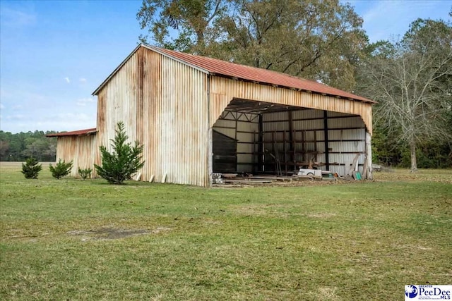 view of outdoor structure featuring a lawn