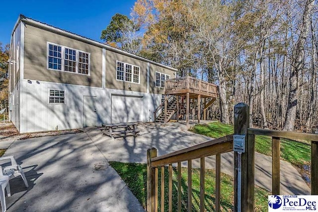 rear view of house with a wooden deck