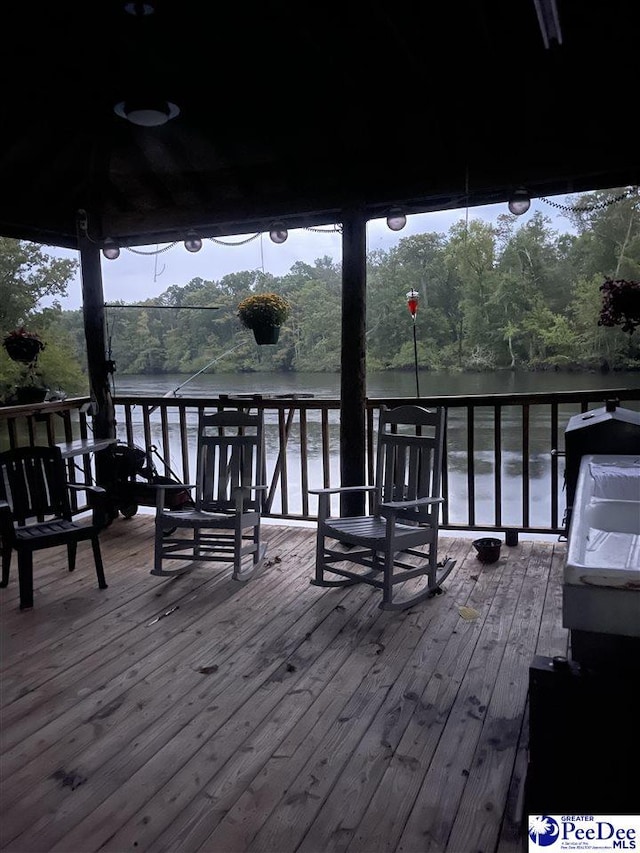 wooden terrace with a water view