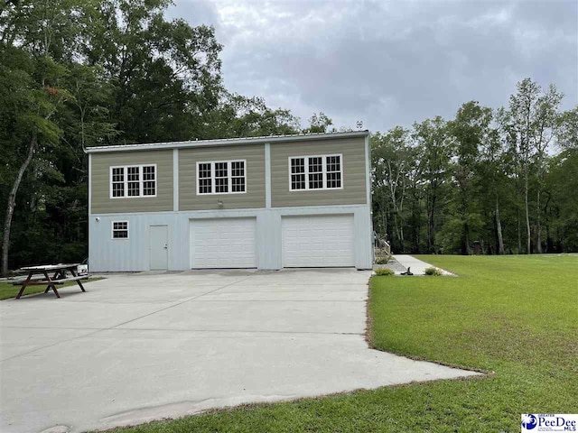 garage with a lawn