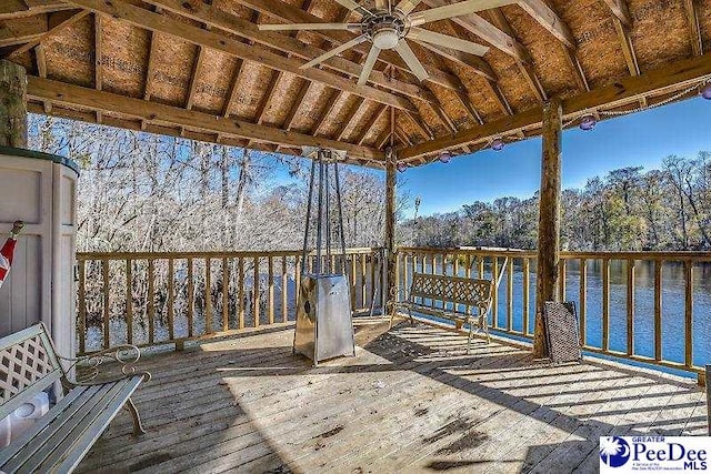 deck with a gazebo, ceiling fan, and a water view