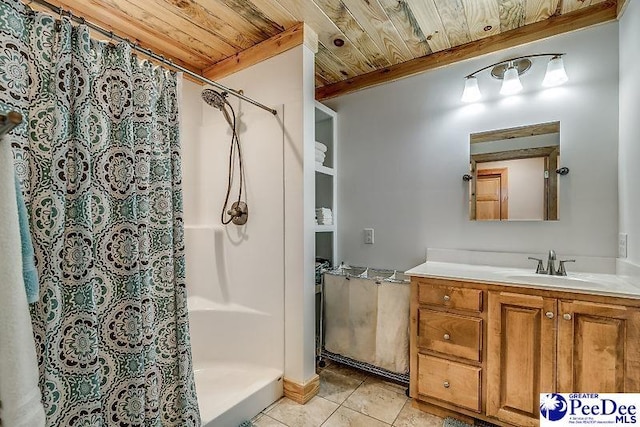 bathroom with wood ceiling, tile patterned floors, vanity, and curtained shower