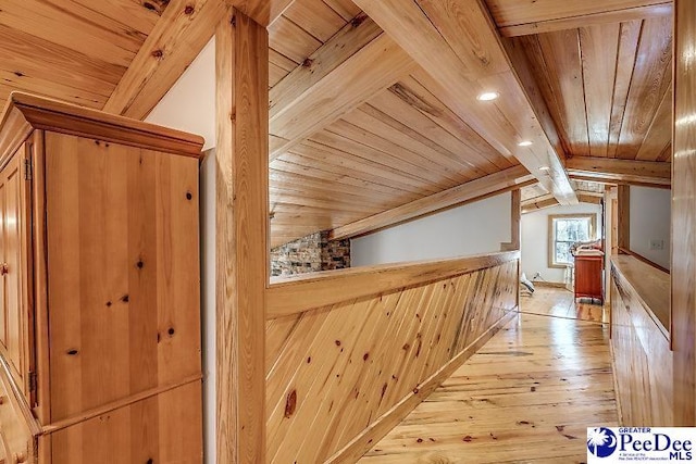 bonus room with wood ceiling, light hardwood / wood-style floors, and lofted ceiling with beams