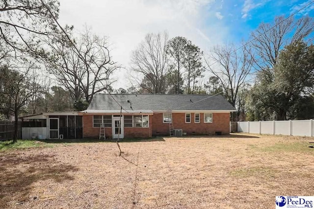 back of house with central AC, crawl space, fence, and a sunroom