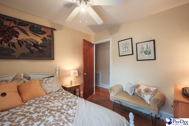 bedroom with baseboards, visible vents, ceiling fan, and wood finished floors