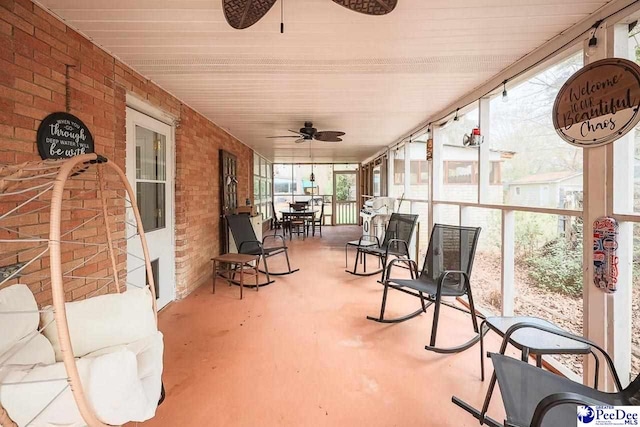 sunroom with a ceiling fan