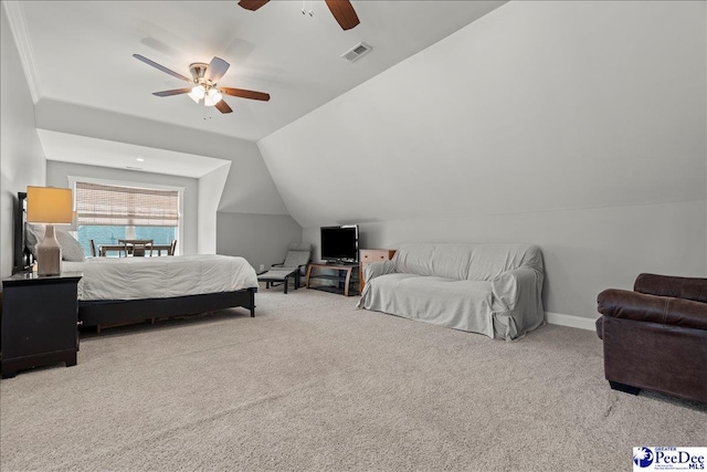 bedroom with visible vents, baseboards, lofted ceiling, and carpet