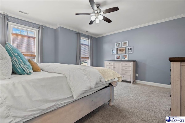 bedroom with visible vents, multiple windows, light colored carpet, and crown molding