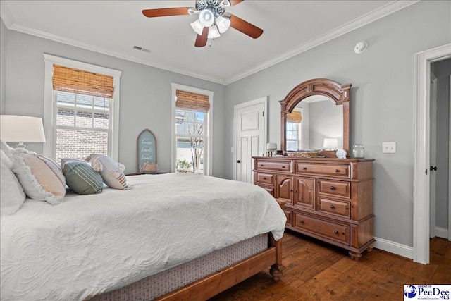 bedroom featuring multiple windows, ornamental molding, and dark wood-style flooring