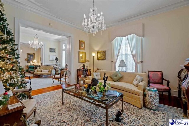 601 E Main St, Dillon, SC 29536 - living room with a chandelier, wood finished floors, and ornamental molding