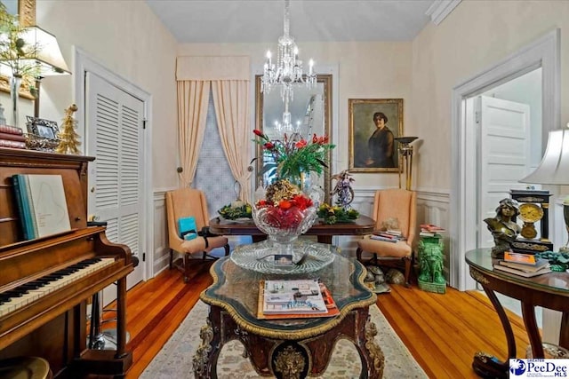 601 E Main St, Dillon, SC 29536 - dining area with a chandelier, wood finished floors, and a wainscoted wall