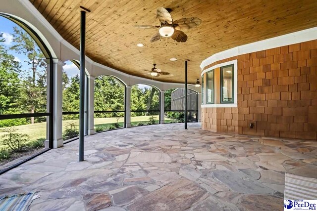 view of patio featuring ceiling fan