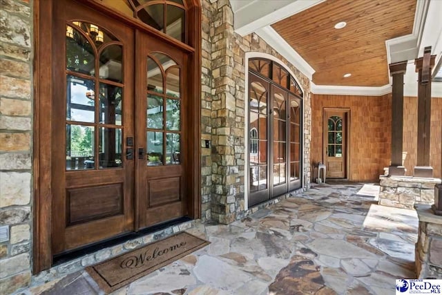 view of exterior entry featuring french doors