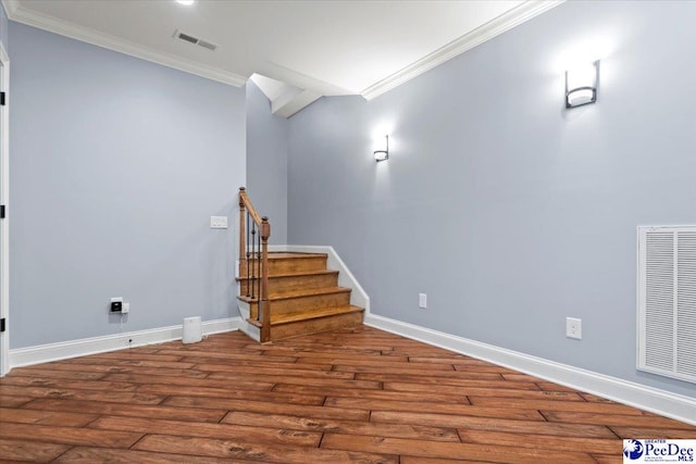 basement featuring ornamental molding and wood-type flooring