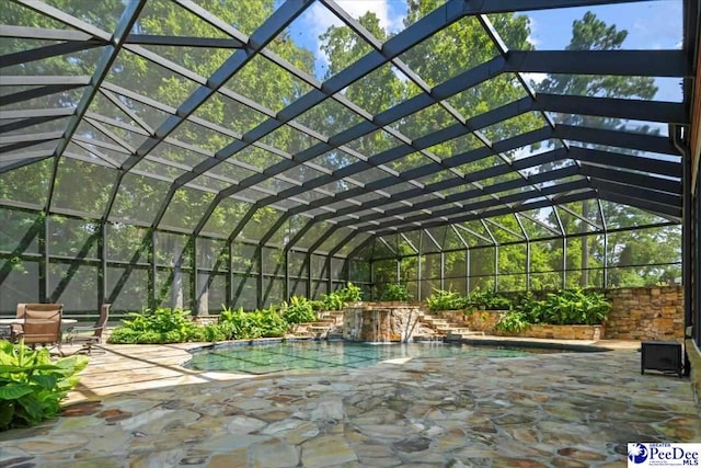 exterior space with pool water feature and glass enclosure