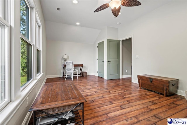 sitting room with dark hardwood / wood-style flooring, vaulted ceiling, and ceiling fan