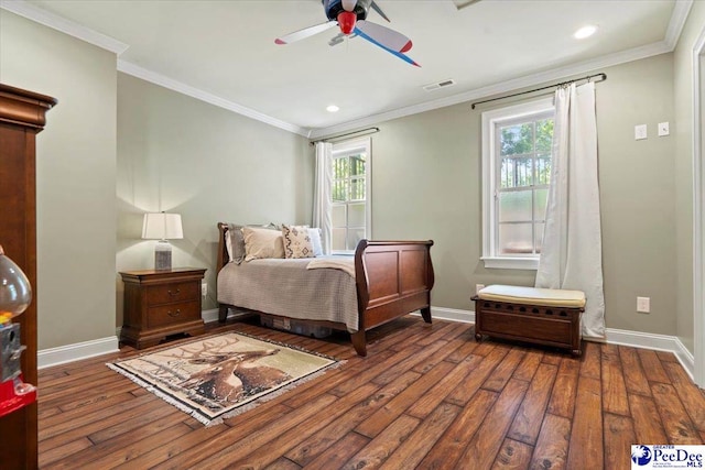 bedroom with multiple windows, ornamental molding, and dark hardwood / wood-style flooring