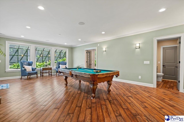 recreation room with billiards, ornamental molding, and light hardwood / wood-style flooring