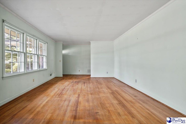 1817 E Sandhurst Dr, Florence, SC 29505 - unfurnished room featuring light wood-type flooring, crown molding, and baseboards