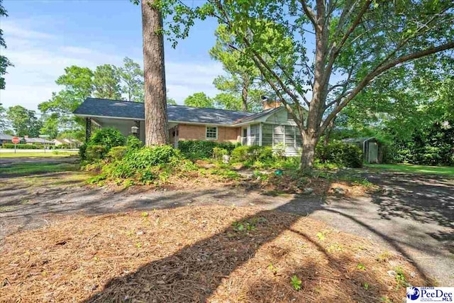 1817 E Sandhurst Dr, Florence, SC 29505 - ranch-style home featuring a chimney