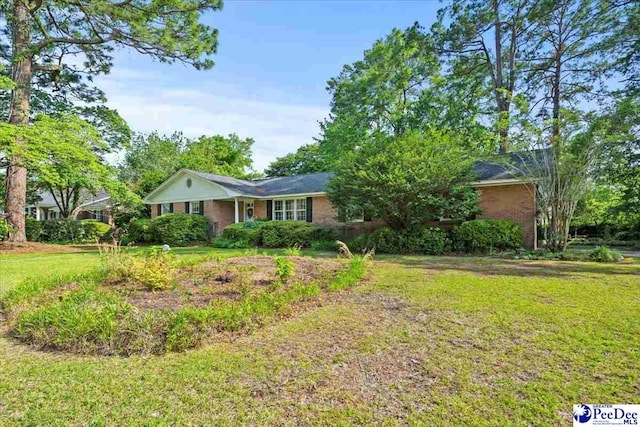 1817 E Sandhurst Dr, Florence, SC 29505 - ranch-style house with a front lawn and brick siding